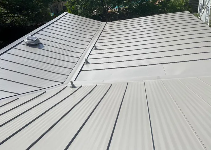 Solar attic fan installed on a metal roof for Roof Ventilation in Star